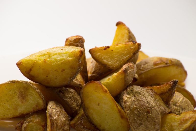 Close up of potato wedges.